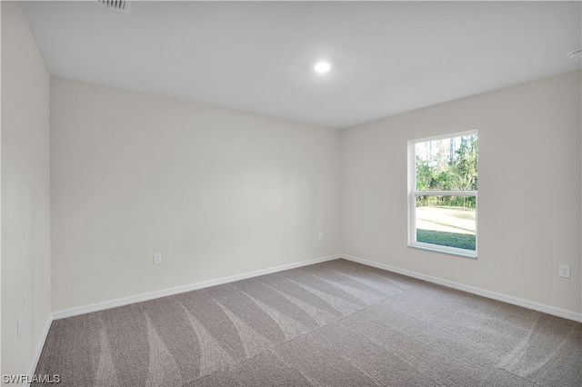 view of carpeted spare room