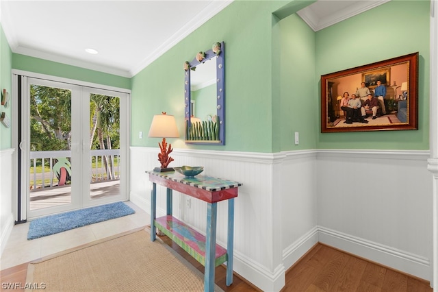 interior space featuring crown molding and light wood-type flooring