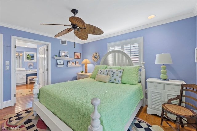 bedroom featuring ceiling fan, ornamental molding, and light hardwood / wood-style flooring