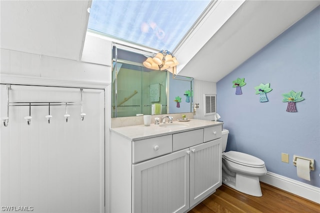 bathroom with vanity, hardwood / wood-style floors, and toilet