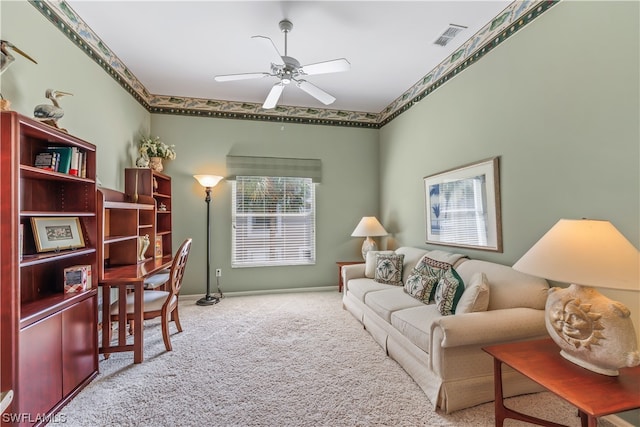 living room featuring ceiling fan and light colored carpet