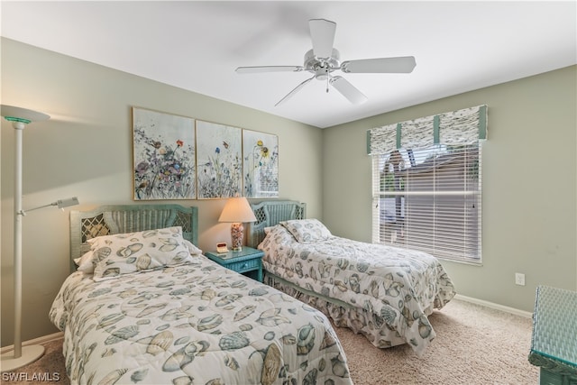 bedroom with ceiling fan and light colored carpet