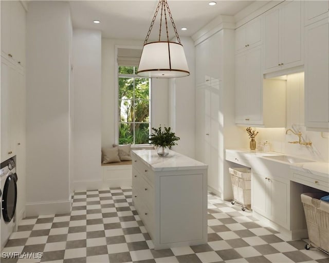 interior space featuring sink and washer / clothes dryer