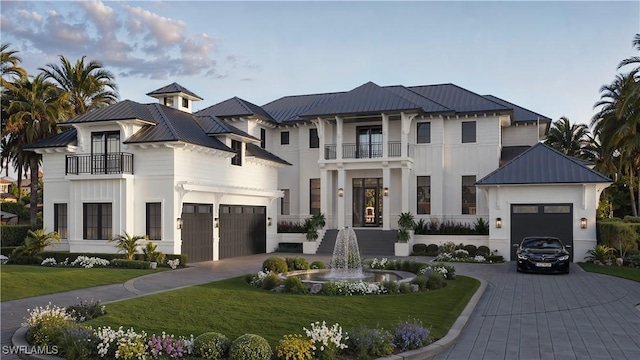 view of front of home with a front yard and a balcony