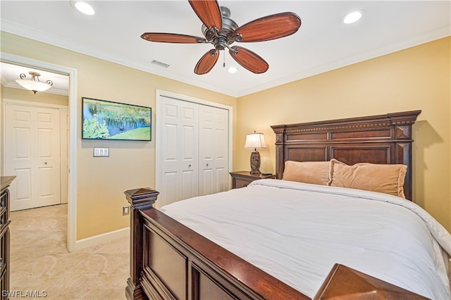 bedroom with ceiling fan, crown molding, and a closet