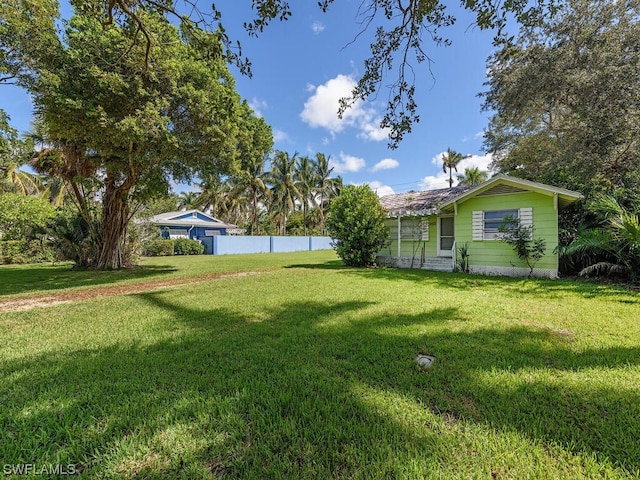 view of yard with fence