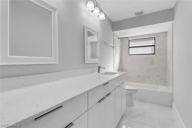 full bathroom featuring tile floors, tiled shower / bath, a chandelier, toilet, and large vanity