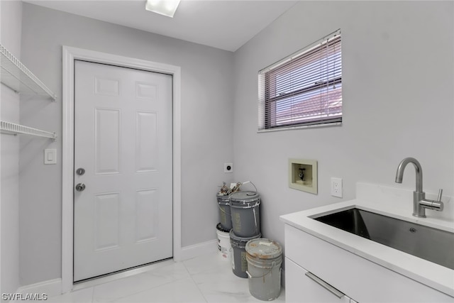 clothes washing area featuring washer hookup, hookup for an electric dryer, sink, and light tile floors