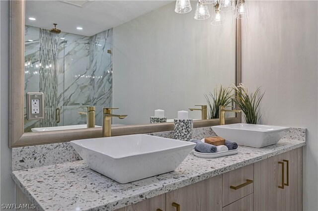 bathroom with vanity and walk in shower