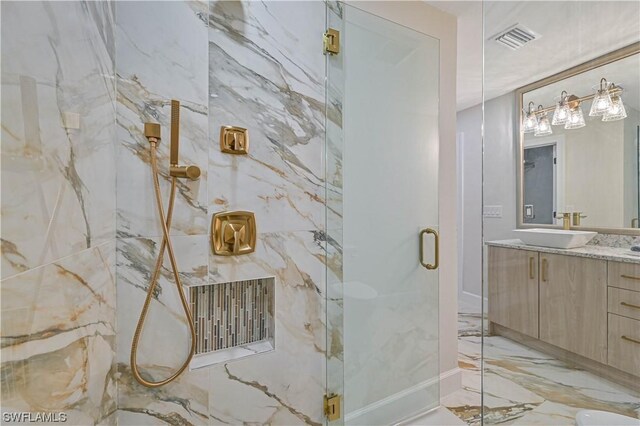 bathroom with vanity and walk in shower