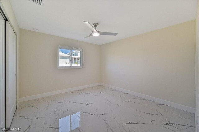 spare room featuring ceiling fan