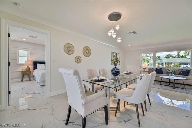 dining area featuring ornamental molding