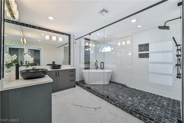 bathroom featuring vanity, tile walls, and shower with separate bathtub