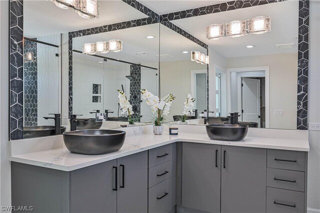 bathroom with a shower and vanity