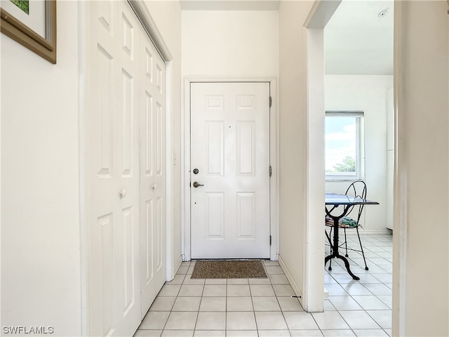 doorway featuring light tile floors