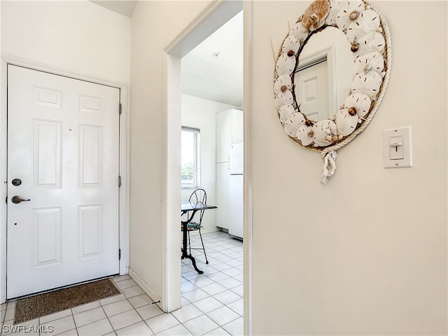 foyer entrance featuring light tile floors