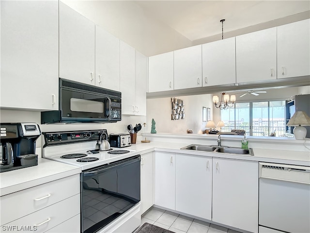 kitchen with white cabinets, light tile floors, white appliances, and sink