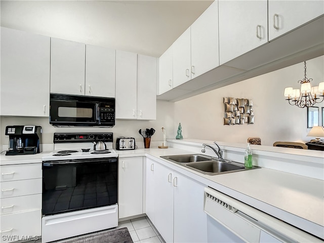 kitchen with white appliances, sink, light tile floors, white cabinets, and a chandelier