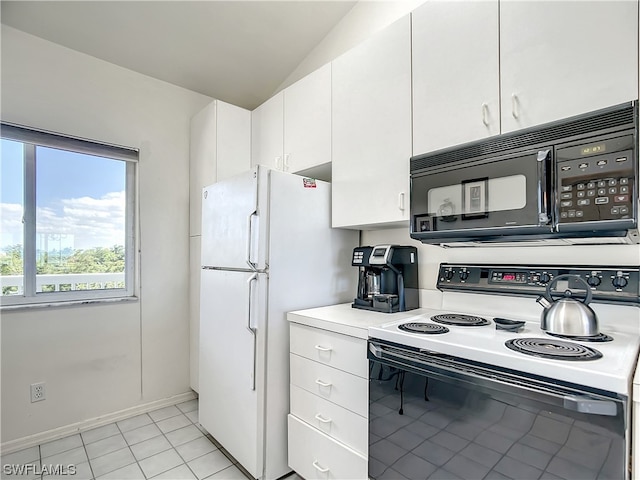 kitchen with white cabinets, light tile floors, lofted ceiling, and white appliances