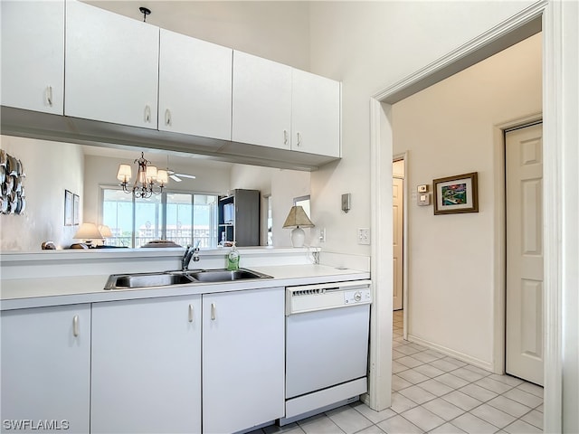 kitchen featuring a chandelier, light tile floors, white cabinets, dishwasher, and sink