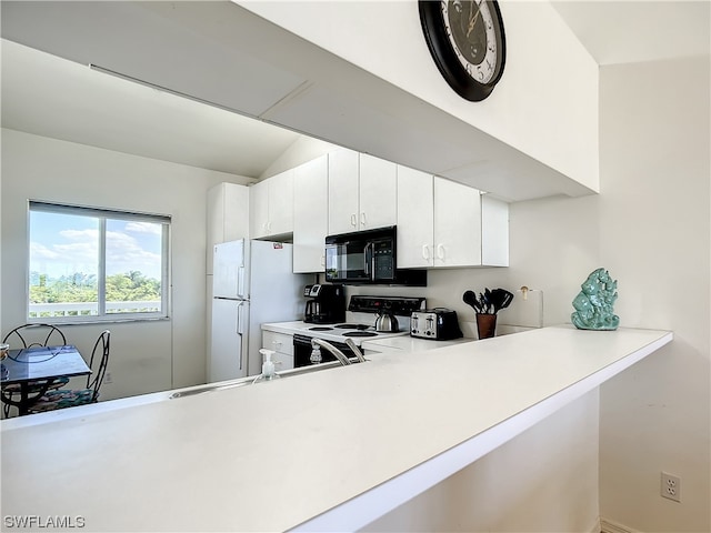 kitchen with white appliances and white cabinetry