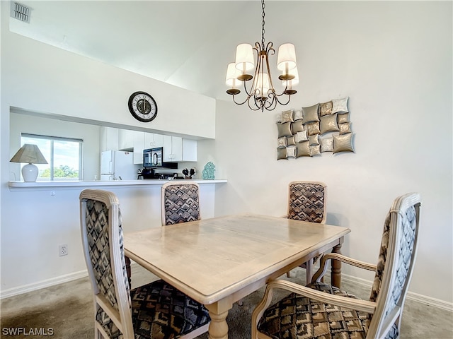 dining area featuring an inviting chandelier and carpet floors