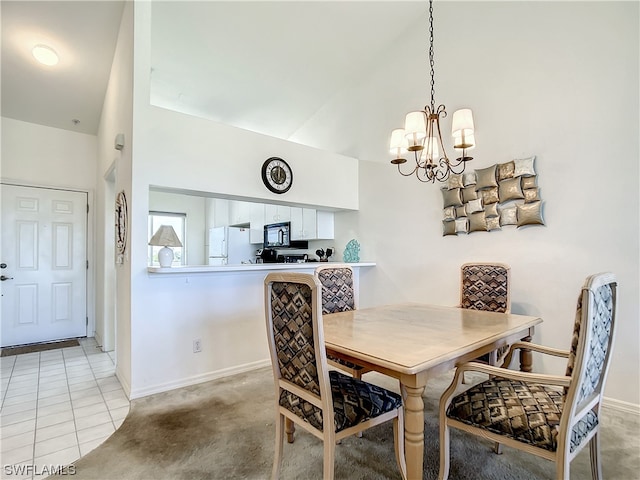 tiled dining room featuring a notable chandelier and high vaulted ceiling