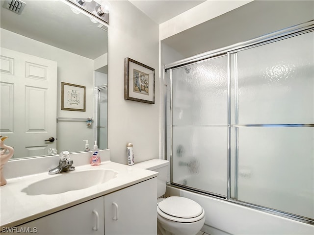 full bathroom featuring enclosed tub / shower combo, toilet, and oversized vanity