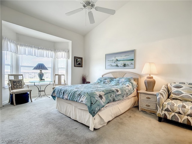 bedroom featuring light carpet, high vaulted ceiling, and ceiling fan