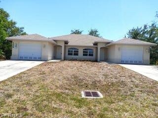 single story home featuring a garage