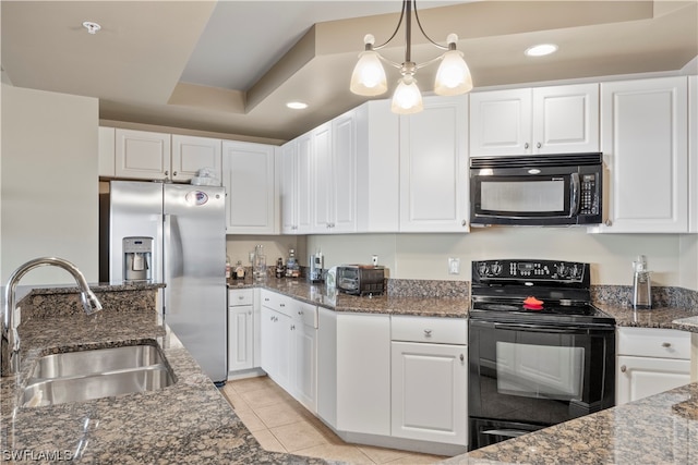 kitchen featuring a chandelier, decorative light fixtures, black appliances, white cabinets, and sink