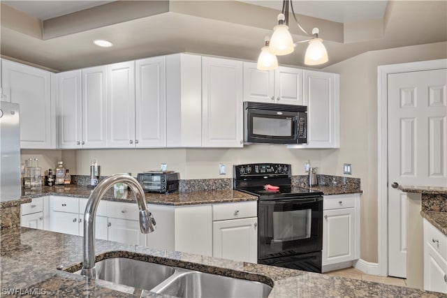 kitchen with white cabinets and black appliances