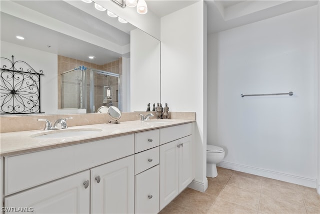 bathroom featuring oversized vanity, tile flooring, dual sinks, and toilet