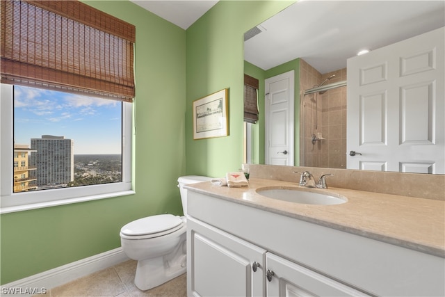 bathroom with vanity, tile flooring, and toilet