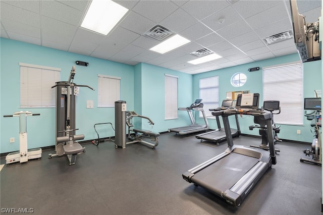 exercise room featuring a paneled ceiling