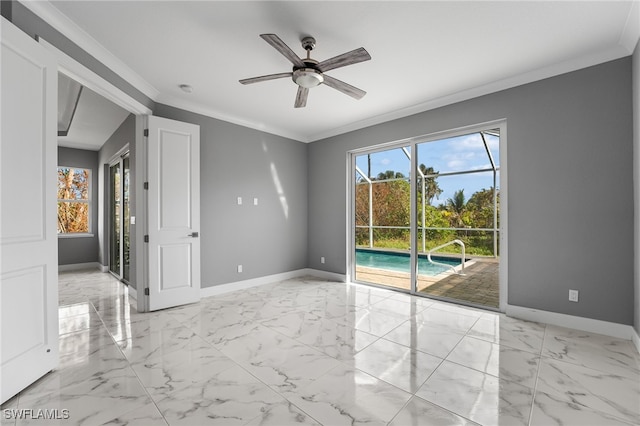 spare room featuring ceiling fan and ornamental molding