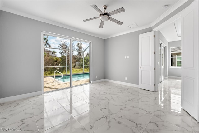 spare room featuring ceiling fan and ornamental molding