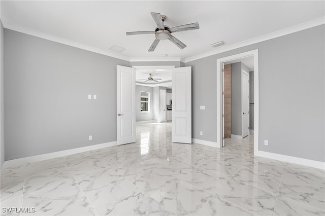 spare room featuring ceiling fan and crown molding