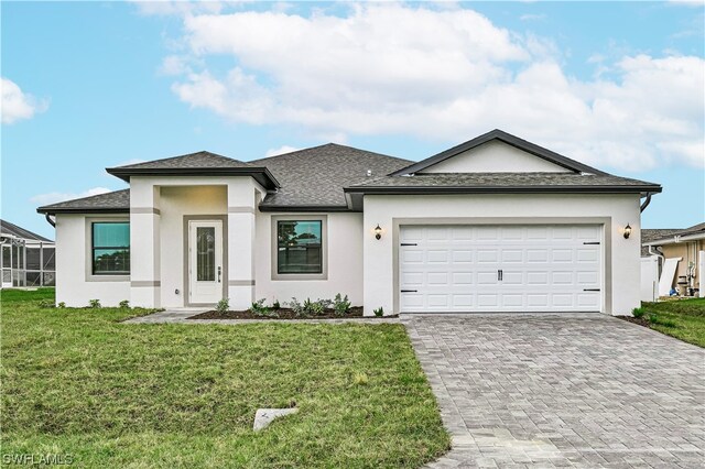 view of front facade featuring a front yard and a garage