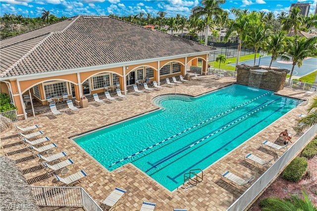 view of pool with pool water feature and a patio area