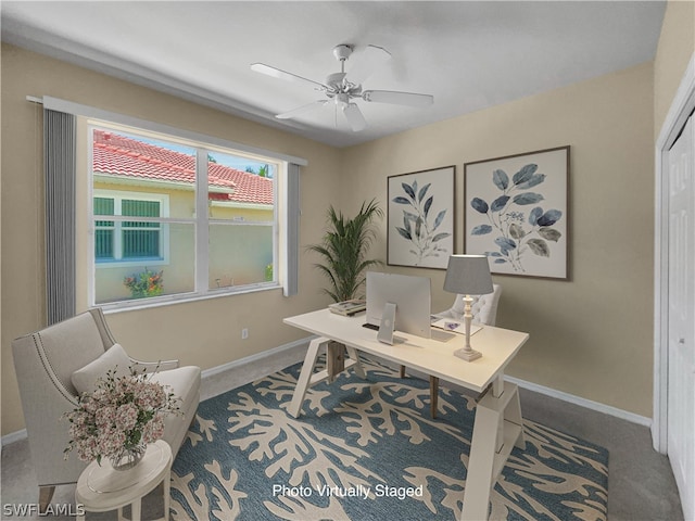 carpeted office featuring ceiling fan and plenty of natural light