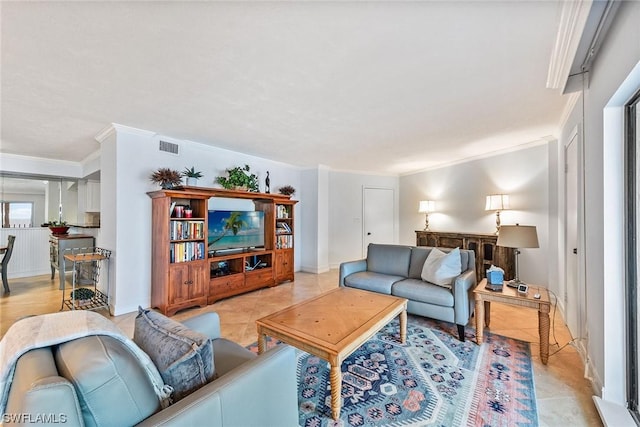 tiled living room with crown molding