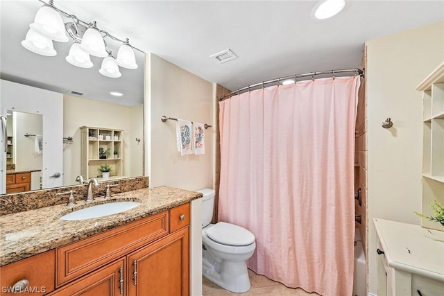 full bathroom featuring tile patterned flooring, vanity, toilet, a chandelier, and shower / bath combo with shower curtain