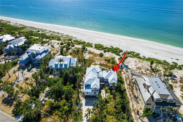 aerial view featuring a water view and a view of the beach