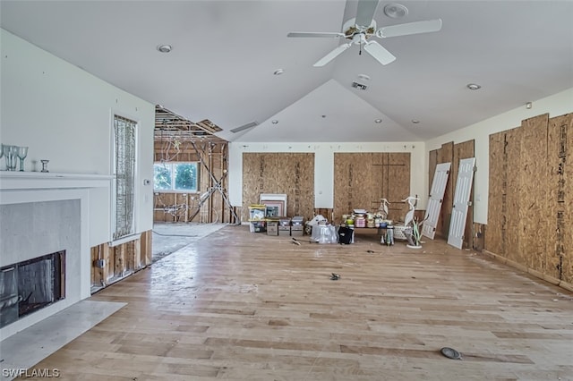 unfurnished room featuring lofted ceiling, light hardwood / wood-style floors, and ceiling fan