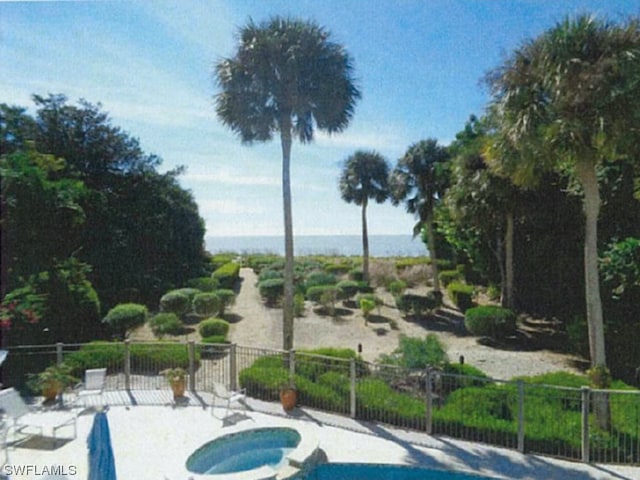 view of swimming pool with a patio area and an in ground hot tub