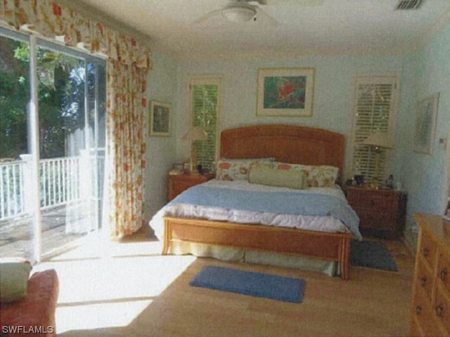 bedroom featuring access to outside and ceiling fan