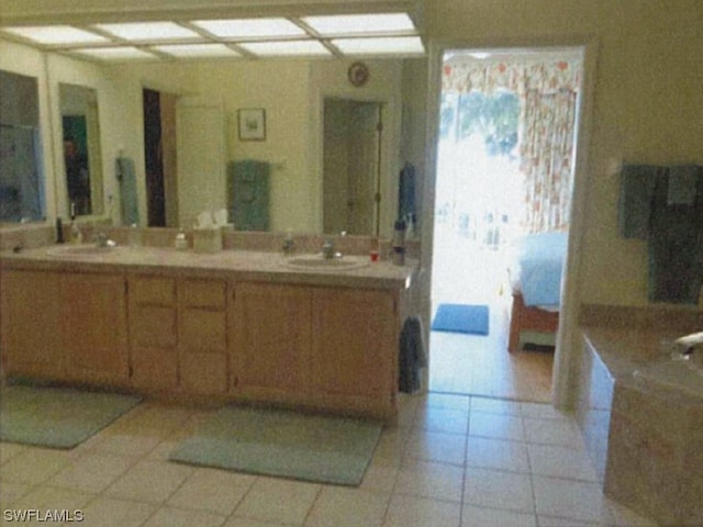 bathroom with tile floors and vanity