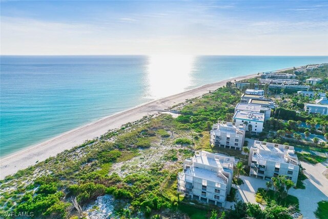 bird's eye view with a beach view and a water view