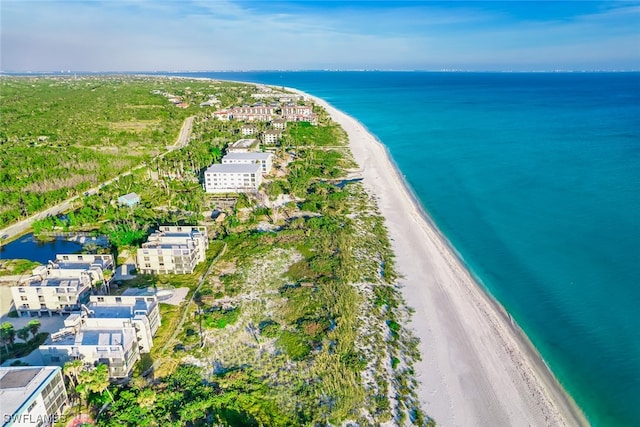 drone / aerial view featuring a view of the beach and a water view